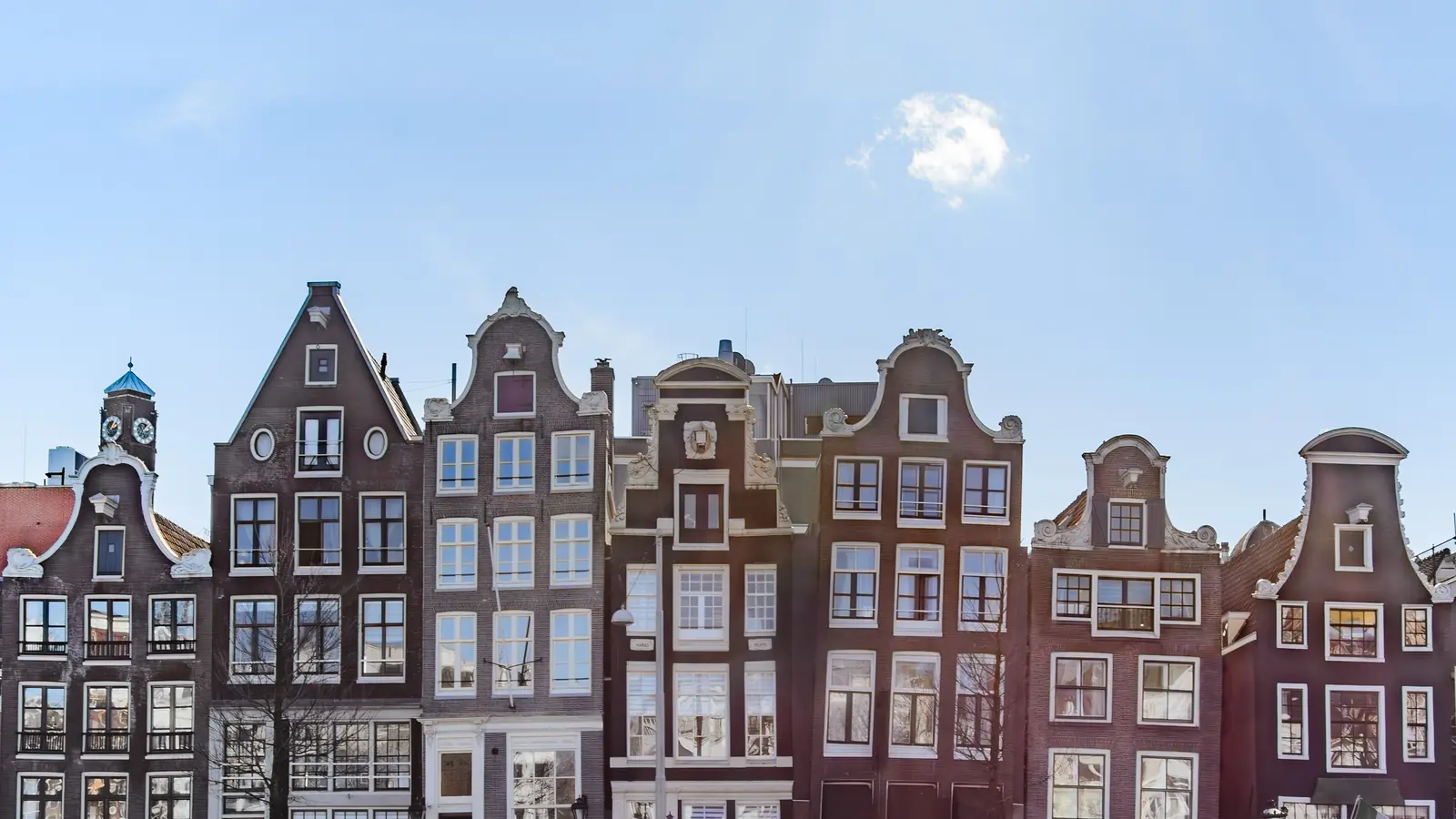 Row of historic Amsterdam canal houses seen straight on, for a Kadaster ownership extract with apostille